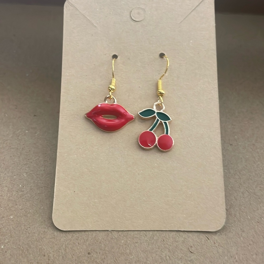 Indie Cherry and Kiss gold earrings with plastic backings